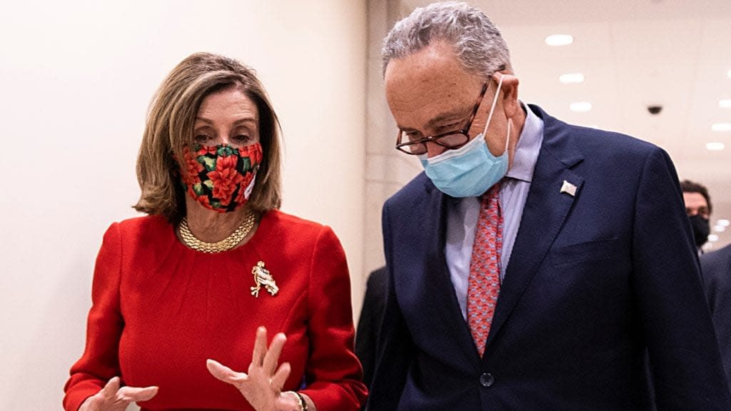 Speaker of the House Nancy Pelosi and Senate Minority Leader Chuck Schumer speak after a press conference on Capitol Hill Sunday in Washington, D.C. (Photo by Tasos Katopodis/Getty Images)