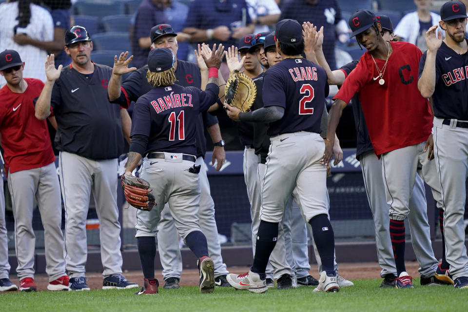 Cleveland Indians first baseman Yu Chang (2) and third baseman Jose Ramirez (11) celebrate with their teammates after a baseball game against the New York Yankees, Saturday, Sept. 18, 2021, in New York. (AP Photo/John Minchillo)