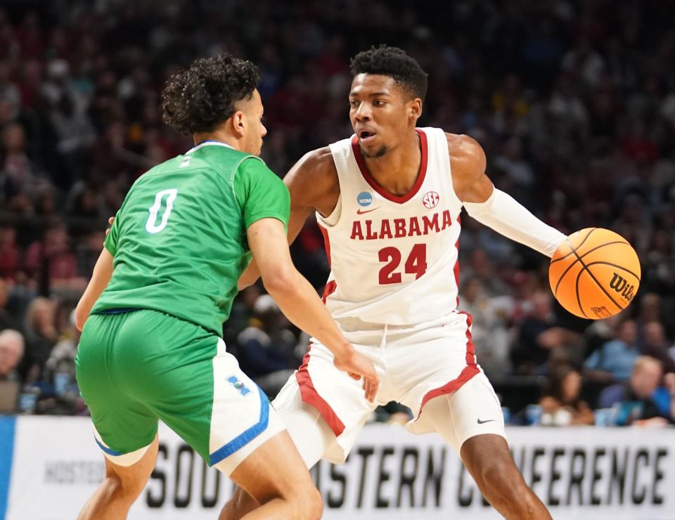 Alabama forward Brandon Miller (24) is defended by Texas A&M-Corpus Christi guard Trevian Tennyson (0) during the first half in the first round of the 2023 NCAA Tournament at Legacy Arena.