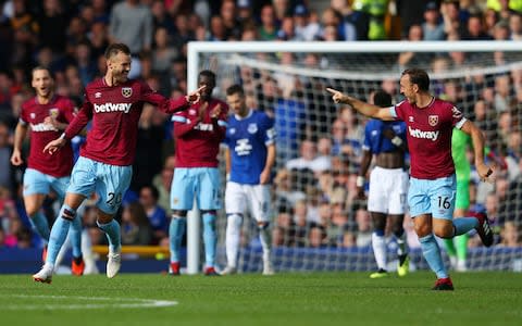 Andriy Yarmolenko of West Ham United celebrates with teammate Mark Noble after scoring his team's second goal during the Premier League match between Everton FC and West Ham United - Credit: Getty images