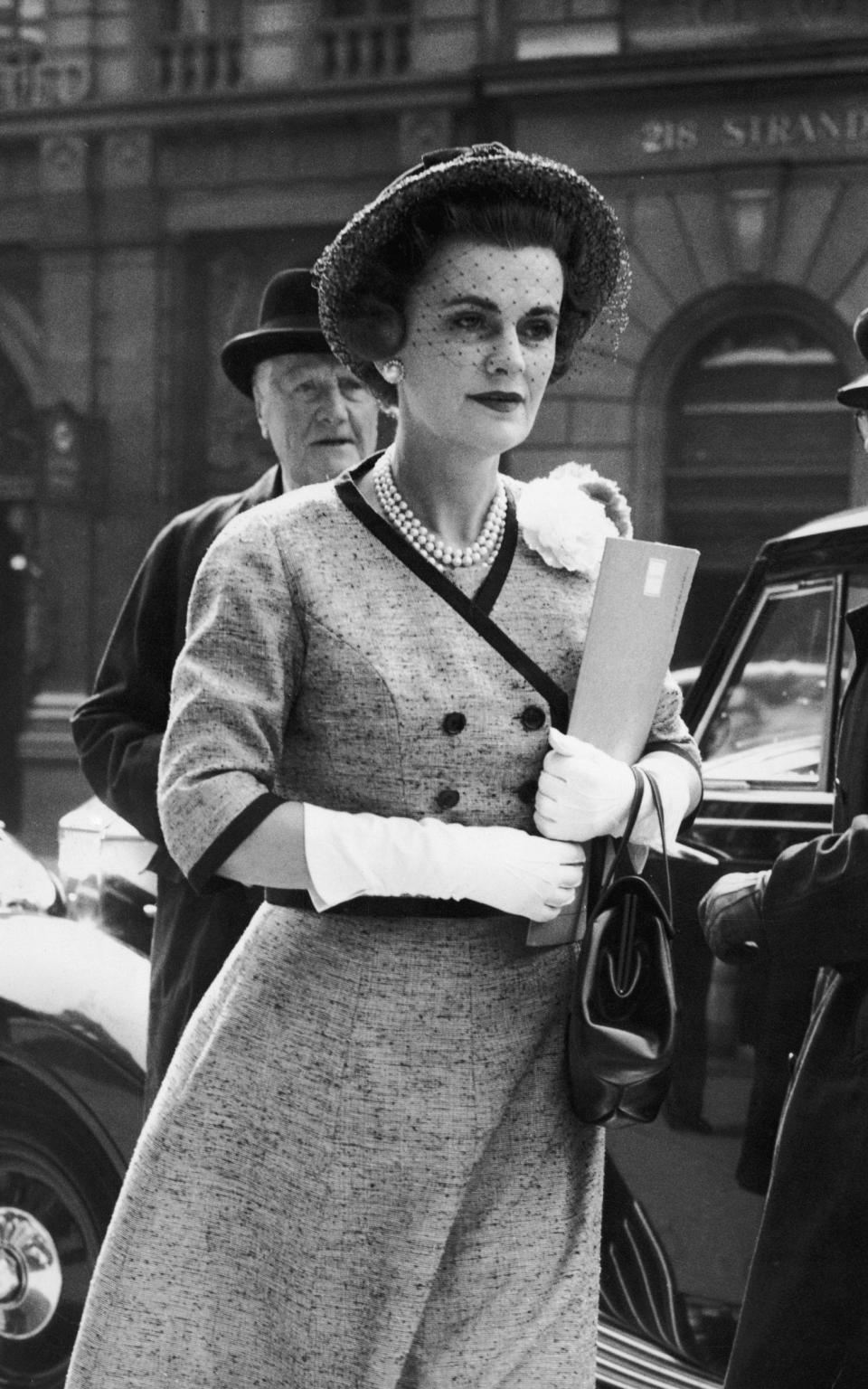 Outside the law courts in the Strand on the second day of her case in 1960 - Central Press