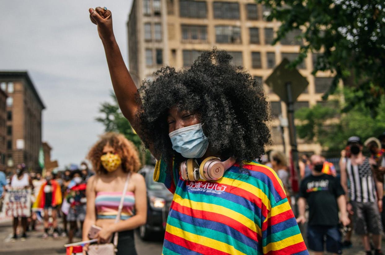 <span class="caption">Youth organizers tend to outperform their peers in school. </span> <span class="attribution"><a class="link " href="https://www.gettyimages.com/detail/news-photo/girl-raises-her-fist-in-the-air-in-front-of-the-minneapolis-news-photo/1223424519?adppopup=true" rel="nofollow noopener" target="_blank" data-ylk="slk:Brandon Bell/Getty Images;elm:context_link;itc:0;sec:content-canvas">Brandon Bell/Getty Images</a></span>