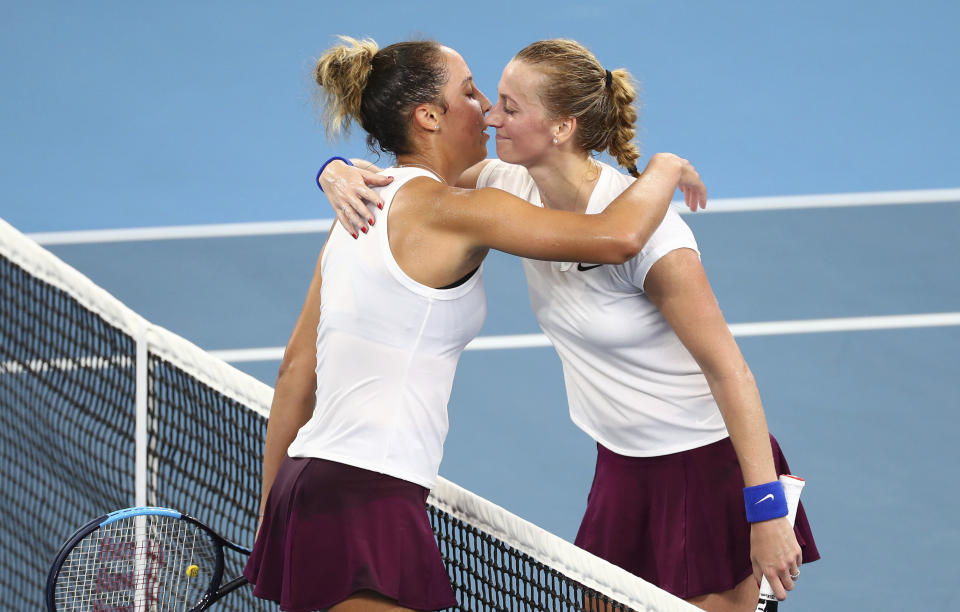 Madison Keys of the United States, left, is congratulated by Petra Kvitova of the Czech Republic, right, after their semifinal match at the Brisbane International tennis tournament in Brisbane, Australia, Friday, Jan. 10, 2020. (AP Photo/Tertius Pickard)