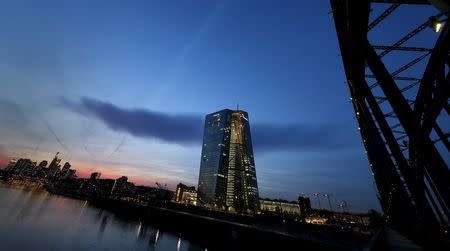 The famous skyline with its banking district (L) and the new headquarter of the European Central Bank (ECB, C) is pictured in Frankfurt early evening April 13, 2015. REUTERS/Kai Pfaffenbach