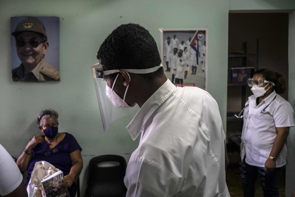 Medical personnel check on the status of people who were vaccinated with the Cuban Abdala vaccine for COVID-19 at a doctors' office in Alamar on the outskirts of Havana, Cuba, Friday, May 14, 2021. Cuba has begun to immunize people this week with its own vaccines, Abdala and Soberana 02, the only ones developed by a Latin American country. (AP Photo/Ramon Espinosa)