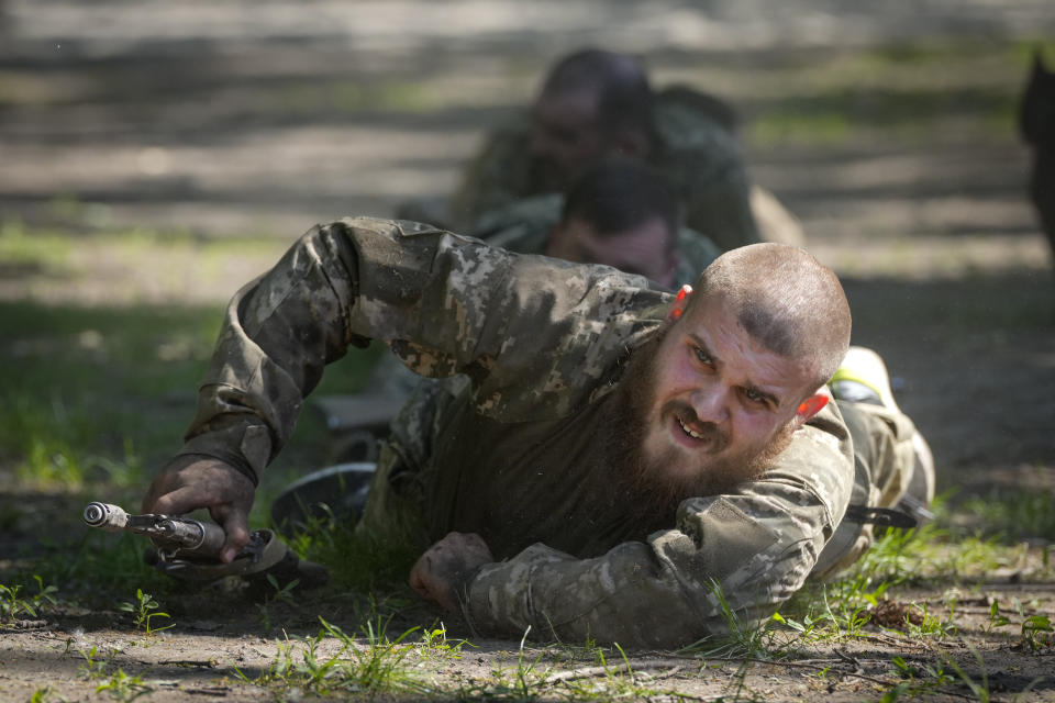 Newly recruited soldiers of the 3rd assault brigade train in Kyiv, Ukraine, Friday, May 17, 2024. A divisive mobilisation law in Ukraine came into force on Saturday, as Kyiv struggles to boost troop numbers after Russia launched a new offensive. (AP Photo/Efrem Lukatsky)