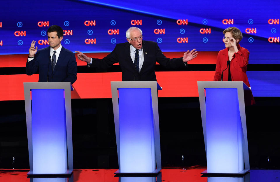 Democratic presidential hopefuls (L-R) Mayor of South Bend, Indiana, Pete Buttigieg, US senator from Vermont Bernie Sanders and US Senator from Massachusetts Elizabeth Warren participate in the first round of the second Democratic primary debate of the 2020 presidential campaign season hosted by CNN at the Fox Theatre in Detroit, Michigan on July 30, 2019. | Brendan Smialowski—AFP/Getty Images