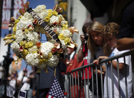 Flowers are seen on the late Robin Williams' star on the Hollywood Walk of Fame in Los Angeles, California August 12, 2014. REUTERS/Lucy Nicholson