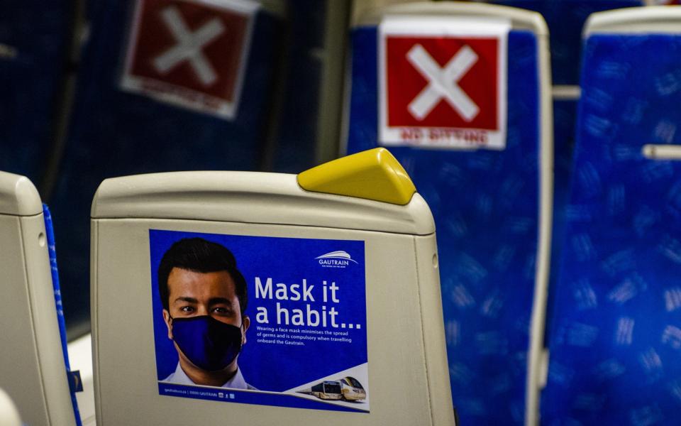 A sign advising of mandatory mask wearing by passengers on-board a Gautrain passenger train in Pretoria, South Africa, on September 10 - Waldo Swiegers / Bloomberg