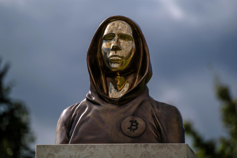 A statue of Satoshi Nakamoto, a presumed pseudonym used by the inventor of Bitcoin, is displayed in Graphisoft Park on September 22, 2021 in Budapest, Hungary. The statue's creators, Reka Gergely and Tamas Gilly, used anonymized facial features, as Nakamoto's true identify remains unconfirmed. (Photo by Janos Kummer/Getty Images)