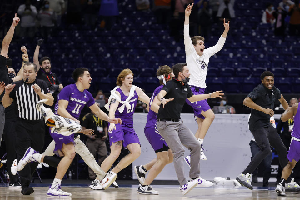 INDIANAPOLIS, INDIANA - MARCH 20: Abilene Christian Wildcats celebrate after defeating Texas Longhorns 53-52 in the first round game of the 2021 NCAA Men's Basketball Tournament at Lucas Oil Stadium on March 20, 2021 in Indianapolis, Indiana. (Photo by Jamie Squire/Getty Images)