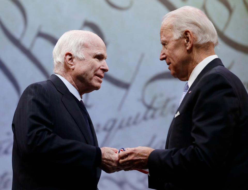 Then Vice President Joe Biden presents the Liberty Medal to Sen. John McCain on Oct. 16, 2017. The honor from the National Constitution Center's Board of Trustees is given to an individual who displays courage and conviction while striving to secure liberty.