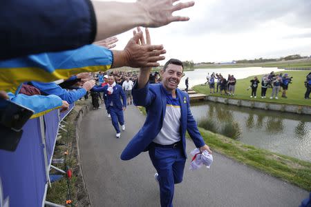 Golf - 2018 Ryder Cup at Le Golf National - Guyancourt, France - September 30, 2018 - Team Europe's Rory McIlroy celebrates with fans after winning the Ryder cup REUTERS/Regis Duvignau