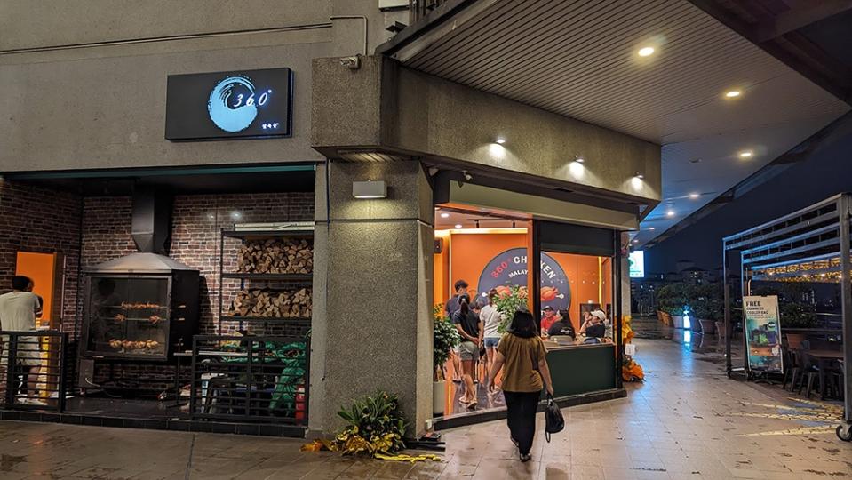 The front of the restaurant as you get off the escalator.