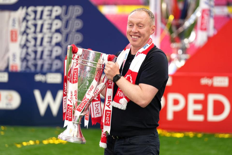 Nottingham Forest manager Steve Cooper celebrates with the trophy after victory in the Championship play-off final (John Walton/PA) (PA Wire)