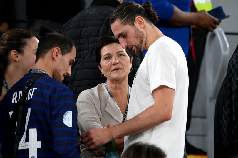 Veronique Rabiot speaks with her son Adrien at the World Cup in 2022