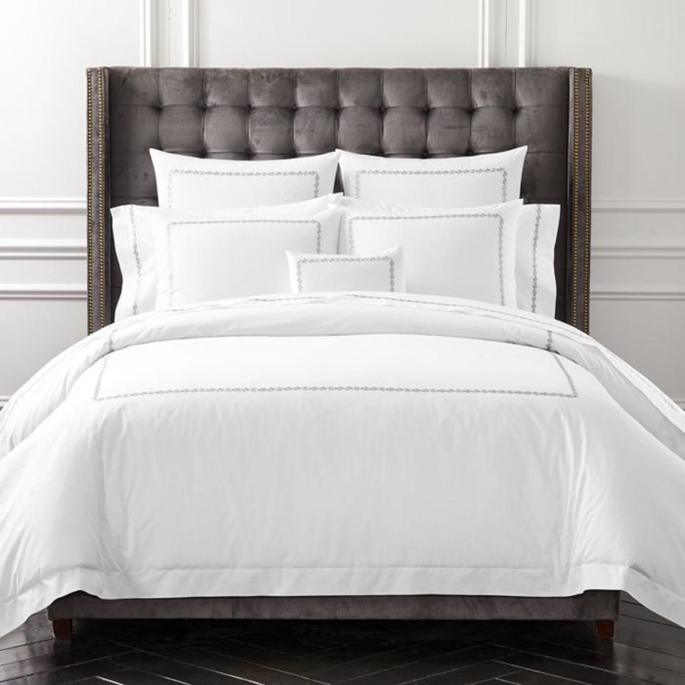 Matouk Schumacher Ivins Bedding Collection on a bed.