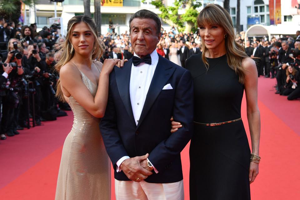 US actor Sylvester Stallone (C) poses with his wife Jennifer Flavin (R) and daughter Sistine as they arrive for the screening of the film 