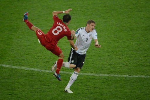 Portuguese midfielder Joao Moutinho (L) vies with German midfielder Bastian Schweinsteiger during the Euro 2012 football match Germany vs Portugal