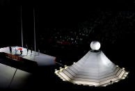 <p>TOKYO, JAPAN - JULY 23: The Japanese flag is carried past the Olympic cauldron during the Opening Ceremony of the Tokyo 2020 Olympic Games at Olympic Stadium on July 23, 2021 in Tokyo, Japan. (Photo by Richard Heathcote/Getty Images)</p> 