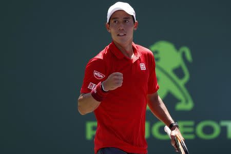 Mar 26, 2017; Miami, FL, USA; Kei Nishikori of Japan celebrates after winning match point against Fernando Verdasco of Spain (not pictured) on day six of the 2017 Miami Open at Crandon Park Tennis Center. Mandatory Credit: Geoff Burke-USA TODAY Sports