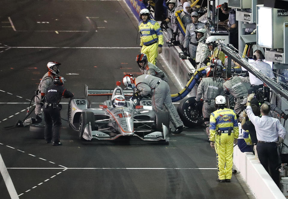 Will Power, of Australia, makes a pit stop during the IndyCar auto race at Gateway Motorsports Park on Saturday, Aug. 25, 2018, in Madison, Ill. (AP Photo/Jeff Roberson)