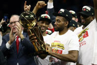 OAKLAND, CALIFORNIA - JUNE 13: Kawhi Leonard #2 of the Toronto Raptors celebrates with the Larry O'Brien Championship Trophy after his team defeated the Golden State Warriors to win Game Six of the 2019 NBA Finals at ORACLE Arena on June 13, 2019 in Oakland, California. NOTE TO USER: User expressly acknowledges and agrees that, by downloading and or using this photograph, User is consenting to the terms and conditions of the Getty Images License Agreement. (Photo by Ezra Shaw/Getty Images)