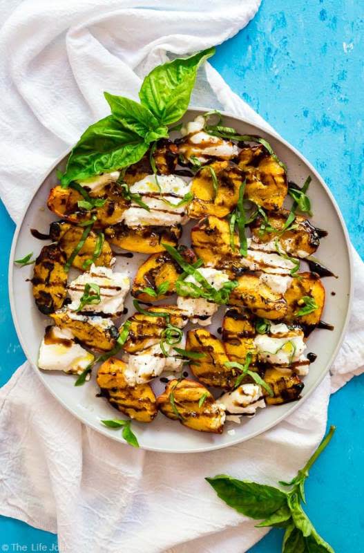 <p>The Life Jolie</p><p>This grilled peaches and burrata salad recipe is an easy twist on a traditional Caprese salad.</p><p><strong>Get the recipe: <a href="http://www.thelifejolie.com/grilled-peaches-and-burrata-salad" rel="nofollow noopener" target="_blank" data-ylk="slk:Grilled Peaches and Burrata Salad;elm:context_link;itc:0;sec:content-canvas" class="link "><em>Grilled Peaches and Burrata Salad</em></a></strong></p>