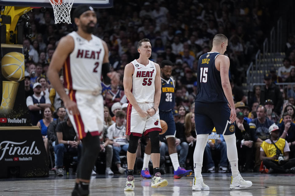 Miami Heat forward Duncan Robinson (55) reacts during the second half of Game 2 of basketball's NBA Finals against the Denver Nuggets, Sunday, June 4, 2023, in Denver. (AP Photo/Mark J. Terrill)