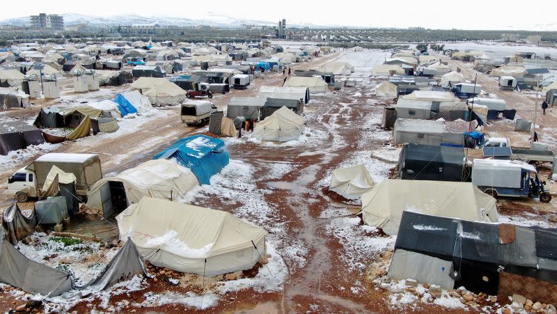 A general view shows tents partially covered in snow at a camp for internally displaced people, in northern Aleppo countryside
