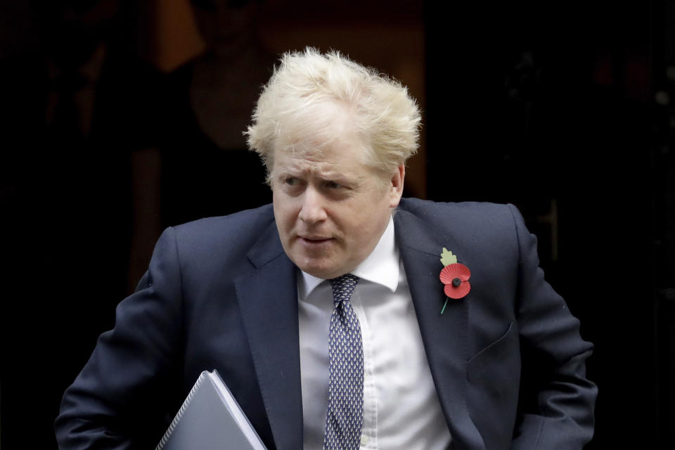 British Prime Minister Boris Johnson leaves 10 Downing Street in London, to attend a weekly cabinet meeting at the Foreign, Commonwealth & Development Office, in London, Tuesday, Nov. 10, 2020. (AP Photo/Matt Dunham)