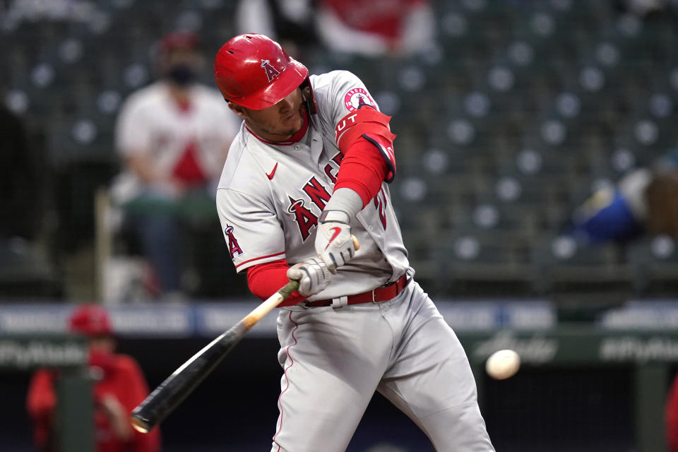 Los Angeles Angels' Mike Trout singles against the Seattle Mariners during the sixth inning of a baseball game Saturday, May 1, 2021, in Seattle. (AP Photo/Elaine Thompson)