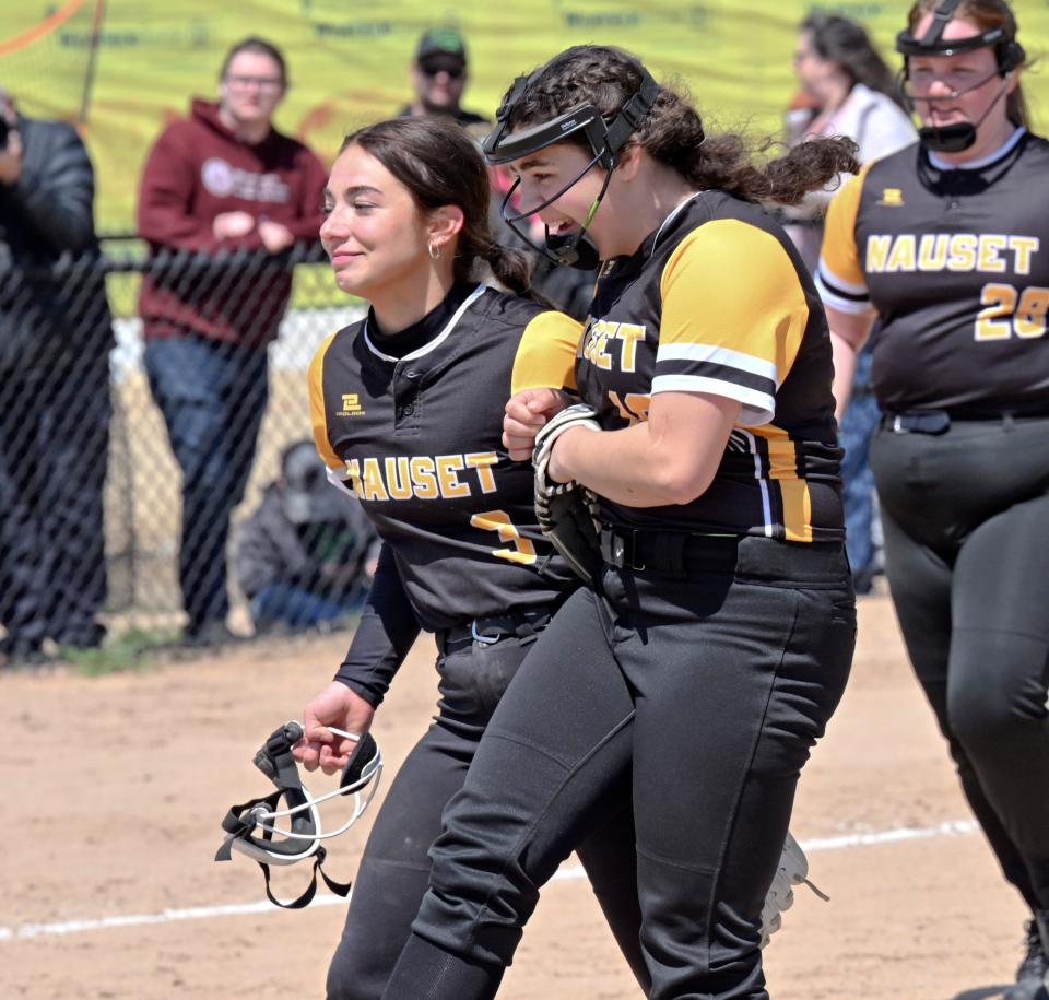 Nauset pitcher Kaylee Davis (left) celebrates with shortstop Jillian Parrott after defeating Upper Cape Tech 19-6.
(Photo: Ron Schloerb/Cape Cod Times)