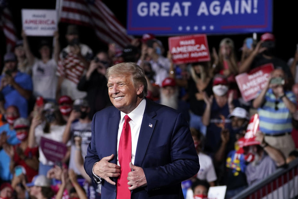 President Donald Trump stands on stage after speaking at a campaign rally at Smith Reynolds Airport, Tuesday, Sept. 8, 2020, in Winston-Salem, N.C. (AP Photo/Evan Vucci)