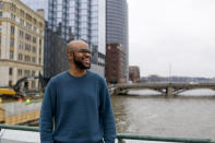 Arick Davis, owner of Last Mile Cafe, poses for a portrait outside of DeVos Place convention center during the annual State of Grand Rapids Business event on Jan. 31, 2024, in Grands Rapids, Mich. Davis says, “I will not vote for someone who could cause so much instability," but is well aware that consumers are feeling pressure on how much they can spend and the challenge that Black-owned businesses like his have with accessing lines of credit to expand. To the extent that the economy is doing well, there is little confidence that it is necessarily sustainable. He'll vote for Biden, he says, but unenthusiastically. (AP Photo/Kristen Norman)