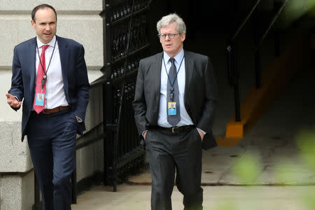 White House legal counsel Emmet Flood (R), walking with Associate Counsel David Morrell, exits the Eisenhower Executive Office Building on the White House campus in Washington, U.S. May 8, 2019. REUTERS/Jonathan Ernst