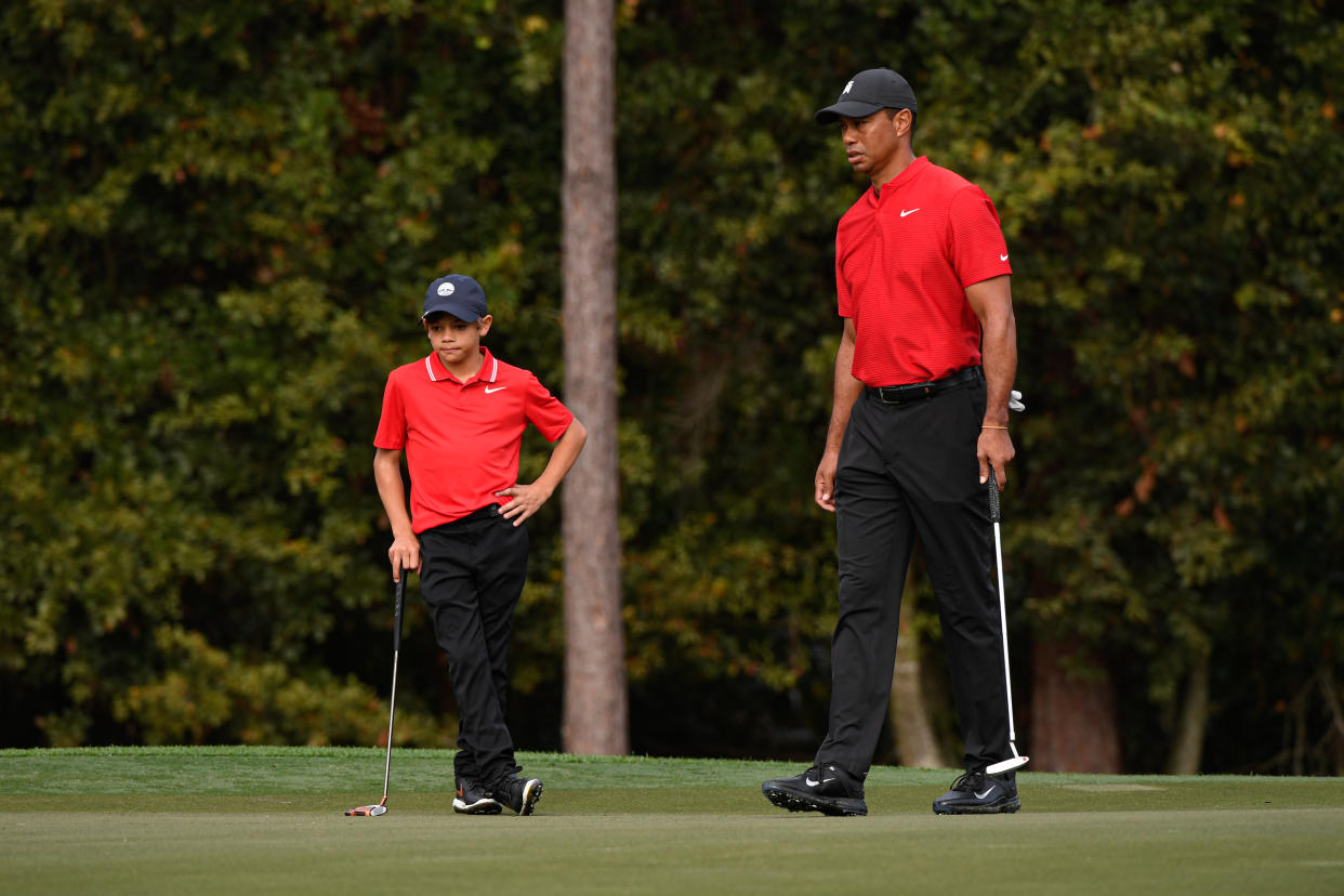 ORLANDO, FL - DECEMBER 20: Tiger Woods and his son Charlie Woods read the first green during the final round of the PGA TOUR Champions PNC Championship at Ritz-Carlton Golf Club on December 20, 2020 in Orlando, Florida. (Photo by Ben Jared/PGA TOUR via Getty Images)