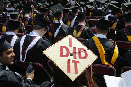 Graduating student Katherine Thomas has "I Did It" written on her mortar board during Commencement Exercises at Boston College in Boston, Massachusetts May 19, 2014. REUTERS/Brian Snyder