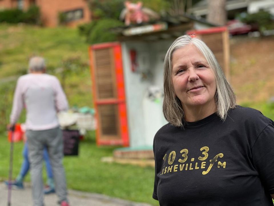 Janet Tubbs hosts an art exhibit on her lawn in Asheville, N.C. Now semi-retired, she moved here three years ago from California, where she worked for the department of transporation. She and her husband wanted a place closer to relatives out east, and they chose this state for its nature – and because it was a swing state.