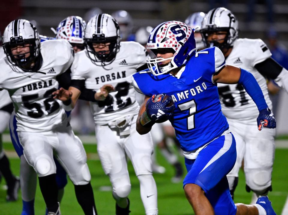 Stamford wide receiver Cle Whitfield runs past the Forsan line during Friday’s Class 2A Div. I bi-district playoff game at the Mustang Bowl in Sweetwater Nov. 10, 2023. Final score was 42-6, Stamford.
