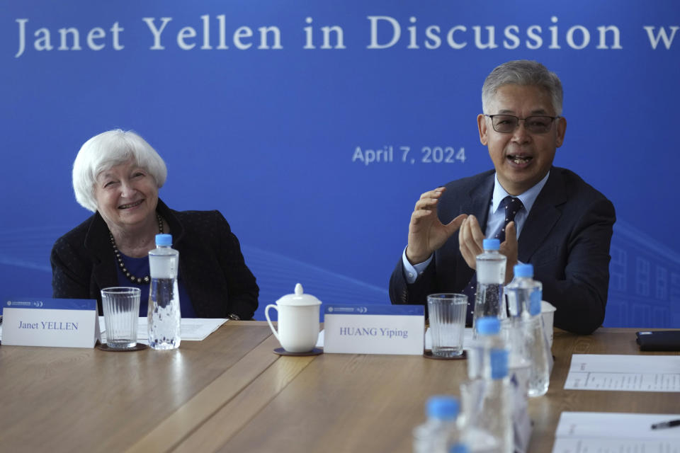 U.S. Treasury Secretary Janet Yellen, left, talks with Huang Yiping, dean of National School of Development at Peking University in Beijing Sunday, April 7, 2024. Yellen met Sunday with Chinese Premier Li Qiang in Beijing and sent a message of mutual cooperation despite the nations’ differences. (AP Photo/Tatan Syuflana, Pool)