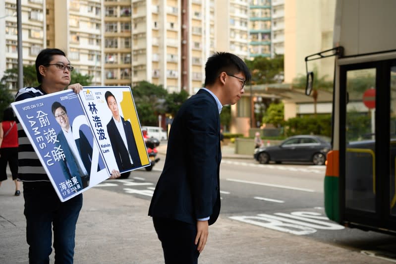 Joshua Wong campaigns for Kelvin Lam, a candidate in Sunday’s district council elections in Hong Kong