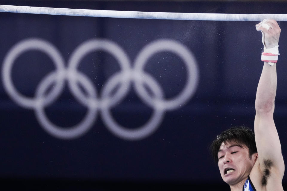 Japan's Kohei Uchimura falls from the horizontal bar during the men's artistic gymnastic qualifications at the 2020 Summer Olympics, Saturday, July 24, 2021, in Tokyo. (AP Photo/Ashley Landis)