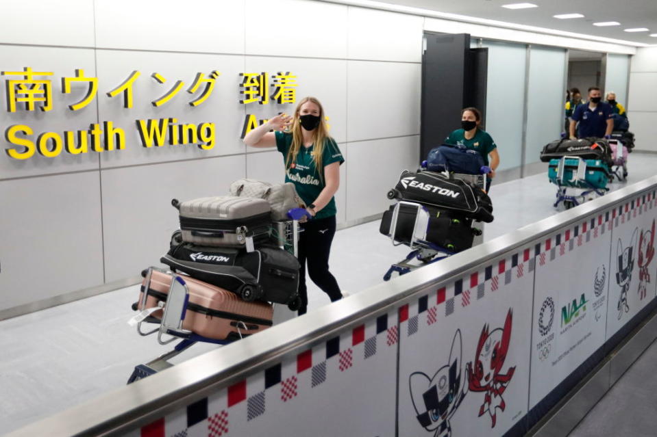 Members of Australia's Olympic softball team, the first national team to come to Japan for pre-Olympic training camp since the Tokyo 2020 Olympic Games were postponed to 2021 due to COVID-19, arrive at Narita International Airport in Narita, east of Tokyo, on June 1, 2021.<span class="copyright">Issei Kato—POOL/AFP/Getty Images</span>