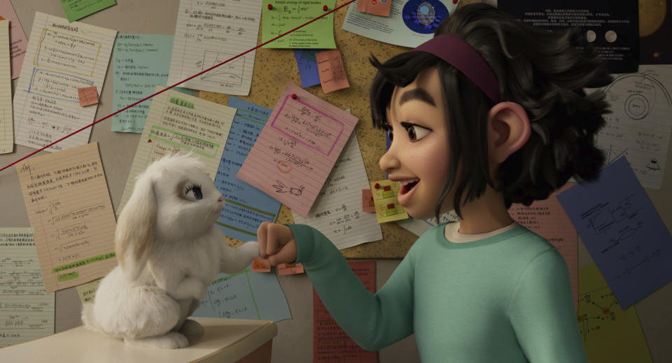 This image released by Netflix shows characters Bungee the rabbit, left, and Fei Fei, voiced by Cathy Ang, in a scene from "Over the Moon." (Netflix via AP)