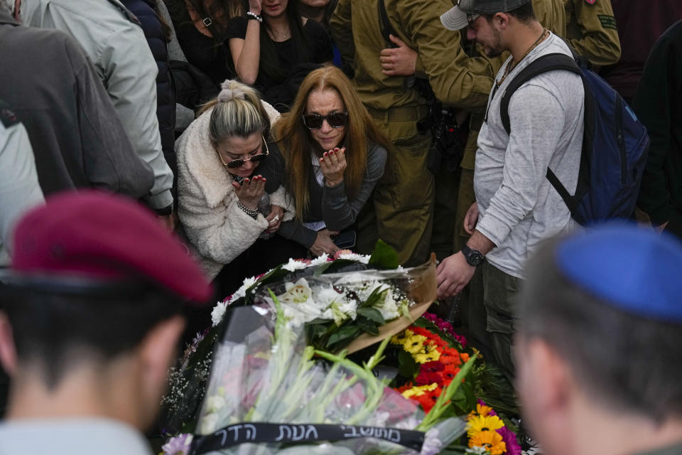 Mourners gather in grief during the funeral of Israeli solider Staff sergeant David Sasson, in Netanya, Israel, Thursday, March 7, 2024. Sasson, 21, was killed during Israel's ground operation in the Gaza Strip, where the Israeli army has been battling Palestinian militants in the war ignited by Hamas' Oct. 7 attack into Israel. (AP Photo/Ariel Schalit)