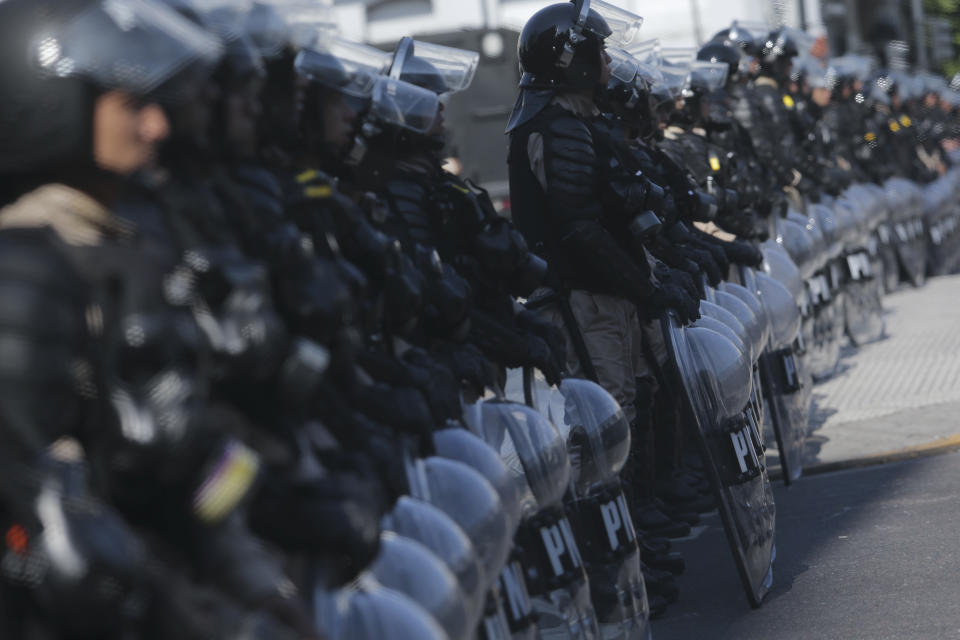Riot police block an avenue as protesters march against the G20 summit being held in Buenos Aires, Argentina, Friday, Nov. 30, 2018. Leaders from the Group of 20 industrialized nations are meeting in Buenos Aires for two days starting today. (Photo: Sebastian Pani/AP)