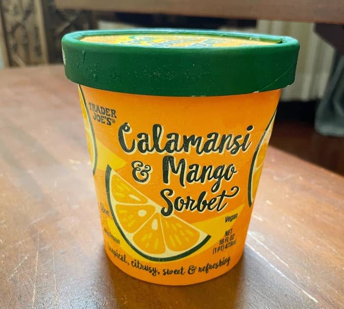 Trader Joe's Calamansi & Mango Sorbet container on a wooden surface