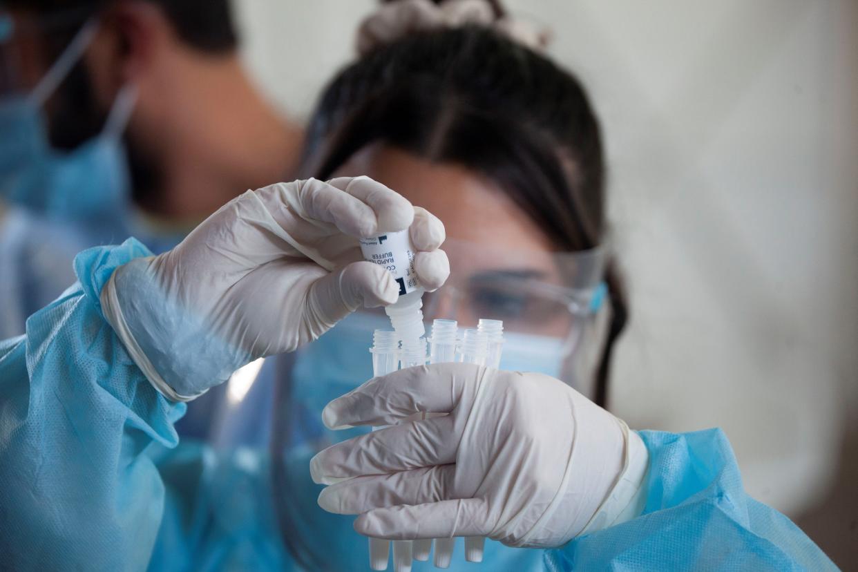 NICOSIA, Feb. 5, 2021 -- A medical worker wearing protective shield prepares the swab sample of COVID-19 rapid test in Nicosia, Cyprus, Feb. 5, 2021. (Photo by George Christophorou/Xinhua via Getty) (Xinhua/George Christophorou via Getty Images)