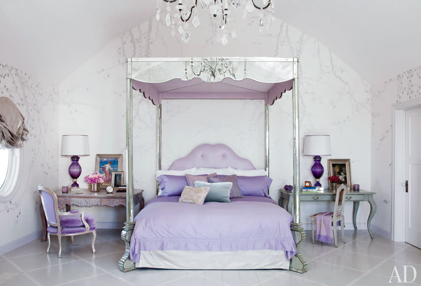 The Osbournesâ€™ mirrored four-poster echoes the style of midcentury French designer Serge Roche; the wallpaper is by de Gournay, and the bedding is by Frette.